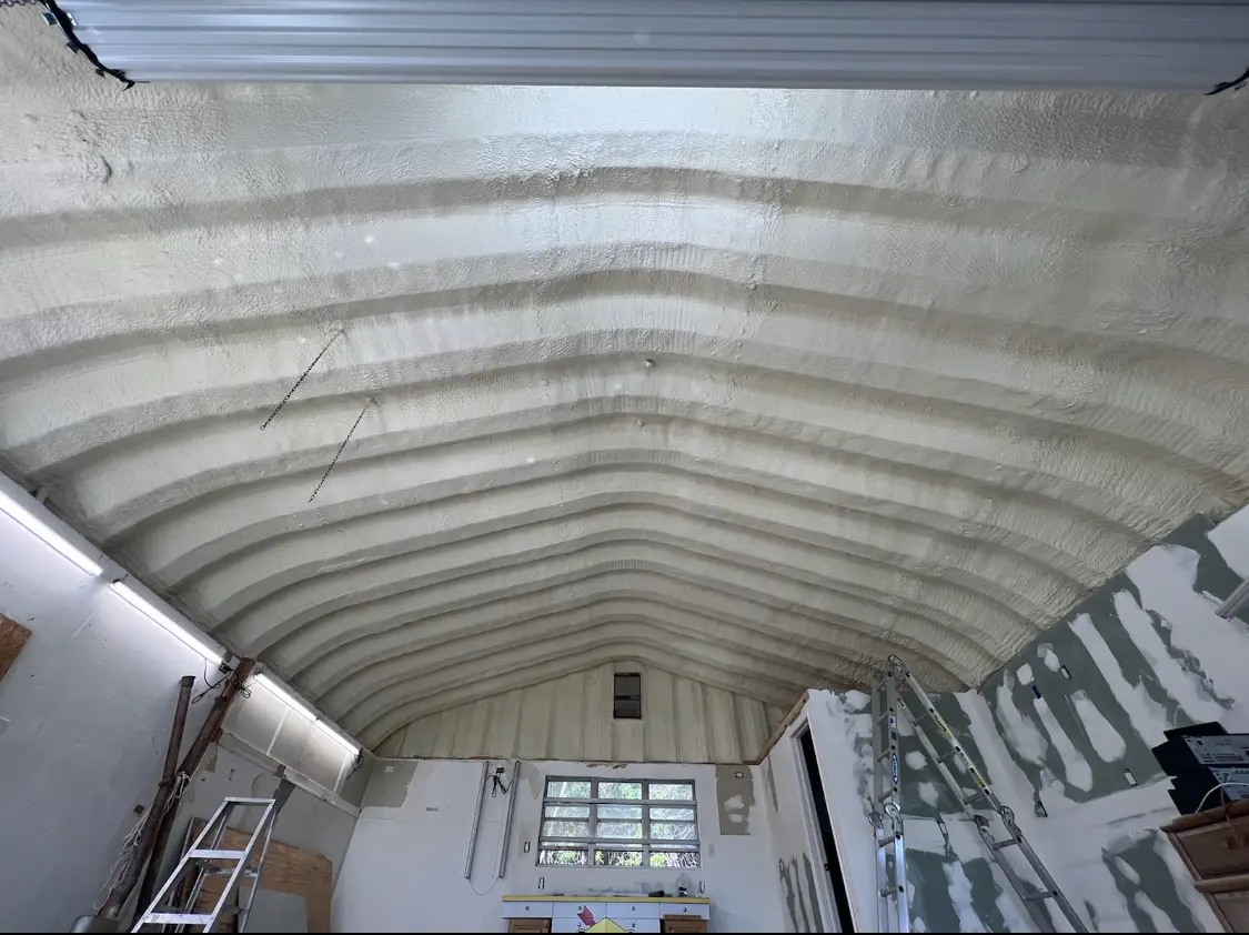 Spray polyurethane foam applied to the underside of a metal roof deck in Fargo